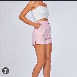 Meshki pink tailored shorts with button detail